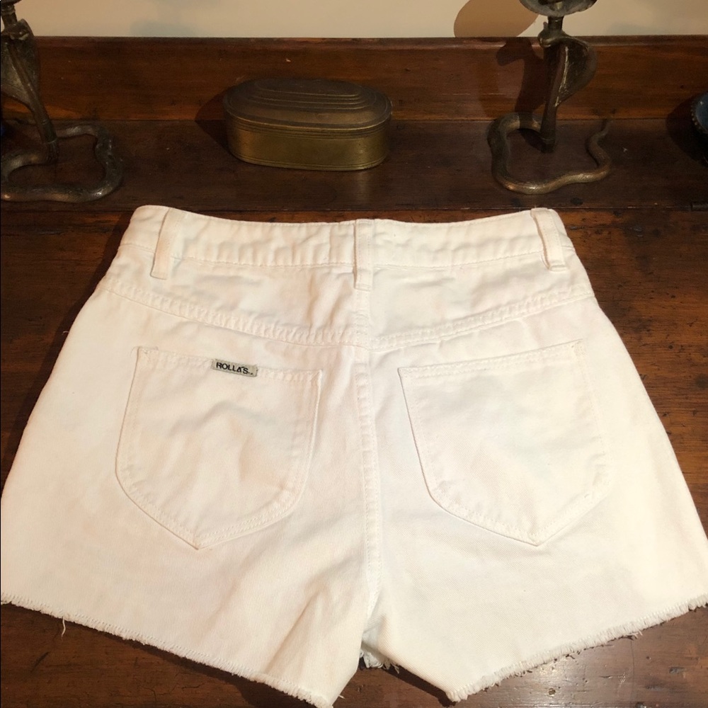 Rollas high waisted white jean shorts.